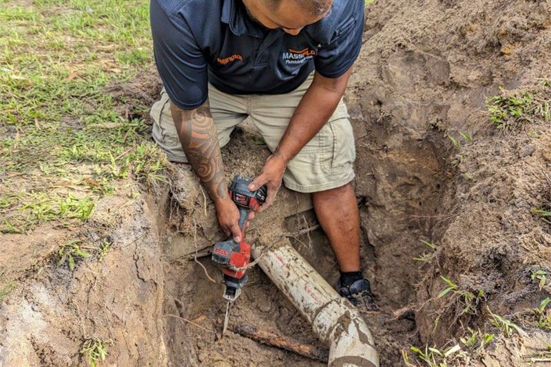 MassFlo technician Wellington performing a professional sewer line repair in a Sarasota, FL residential yard